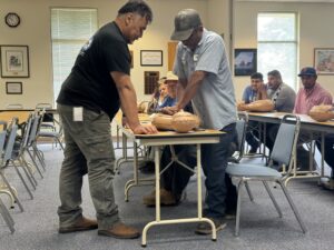 Juan Allen providing CPR training to farmworker.